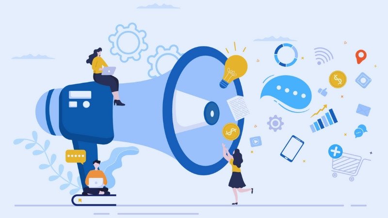 Mô tả hình ảnh: Một bức tranh lớn mô tả các kênh truyền thông khác nhau như mạng xã hội, báo chí, điện thoại, máy tính, được kết nối với nhau, thể hiện sự tích hợp trong truyền thông Marketing.